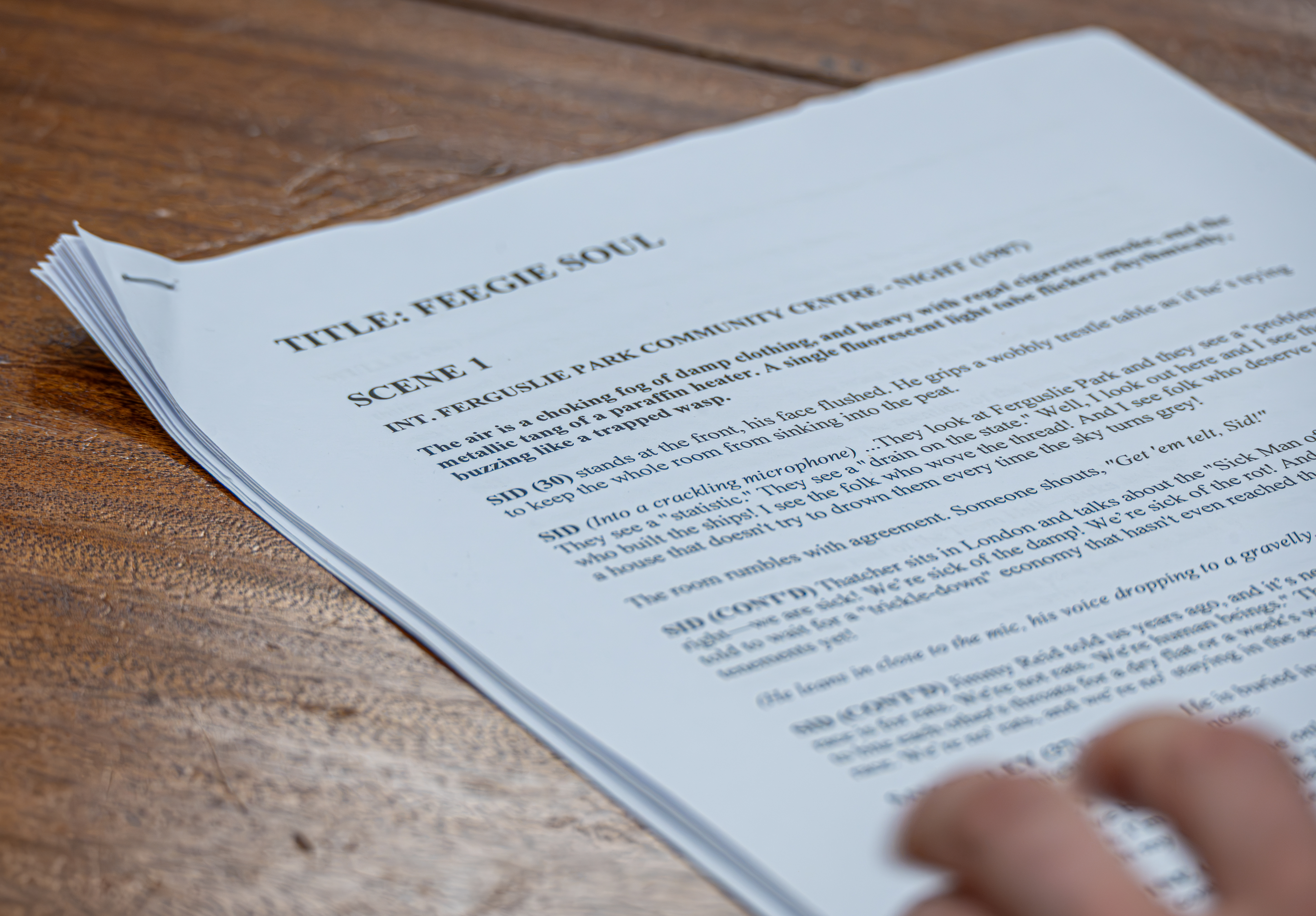 A printed script on a table during a creative activity